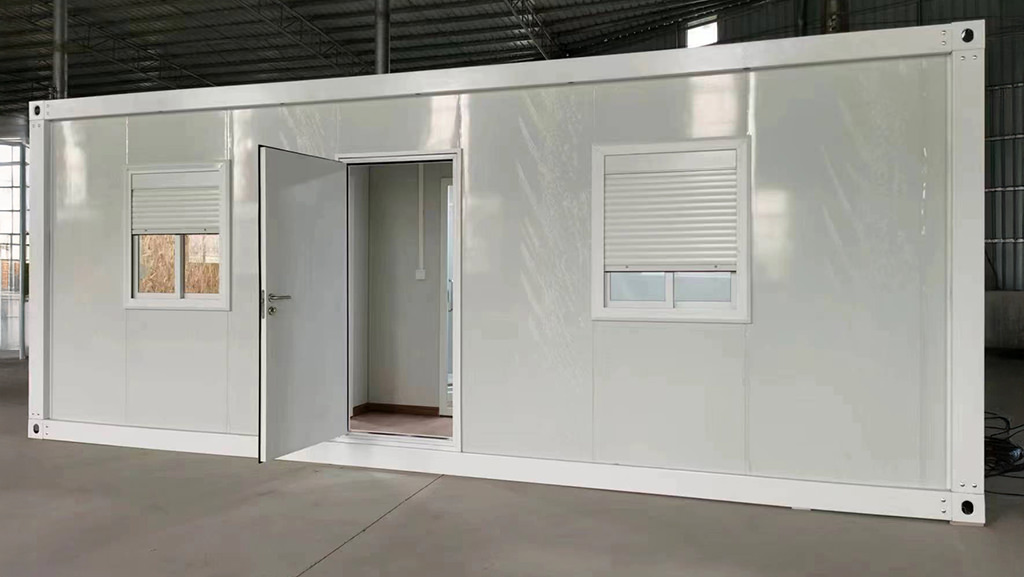 Worker accommodation unit with open entry door and roller shutter windows
